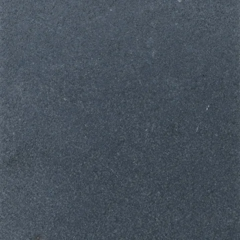 Stonelux Black Basalt sample with a dark charcoal textured surface
